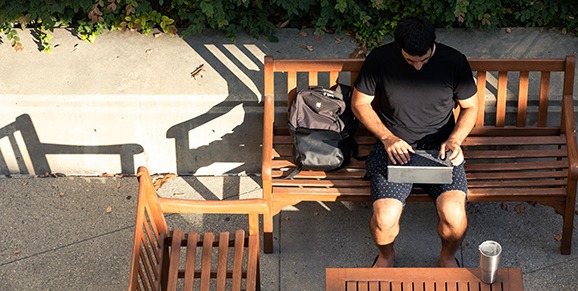 Man on Bench with Laptop